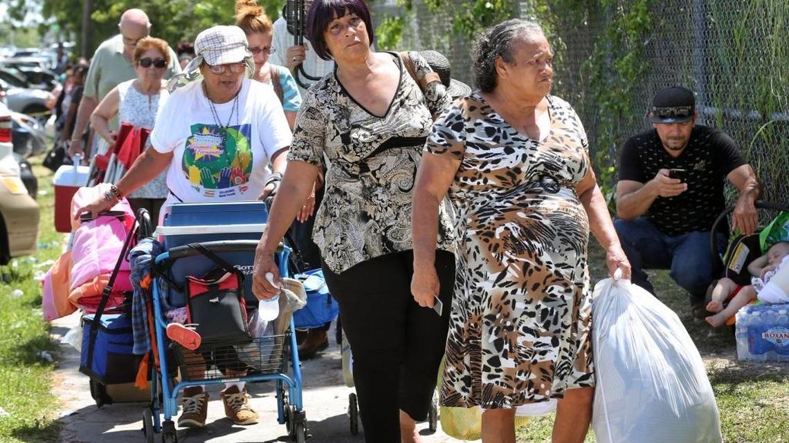 Hundreds of Hurricane Irma evacuees wait in line for hours under the scorching sun to enter Robert Morgan Educational Center in South Dade, which immediately filled to capacity on Friday, September 8, 2017