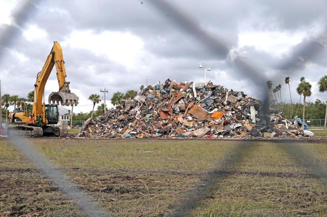 A mountain of debris is growing as Everglades City tries to clear the streets of trash from homes damaged by Hurricane Irma.