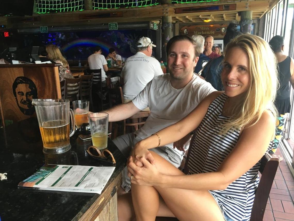 Ashley and Zach Winkler at a makeshift two-top at the Flanigan’s restaurant in Coconut Grove