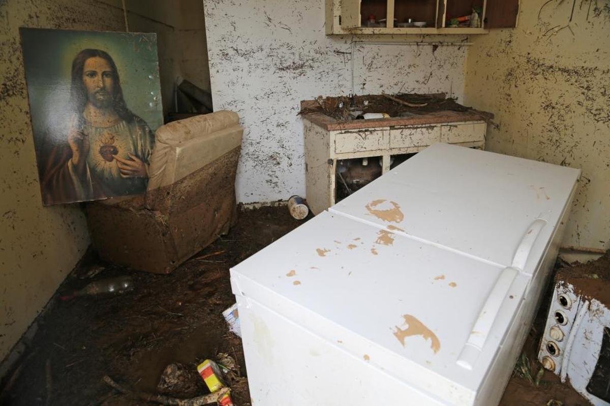 A picture of Jesus was salvaged and placed on a leather couch as the interior of a home is heavily damaged in Arecibo, Puerto Rico, on Saturday, September 23, 2017.