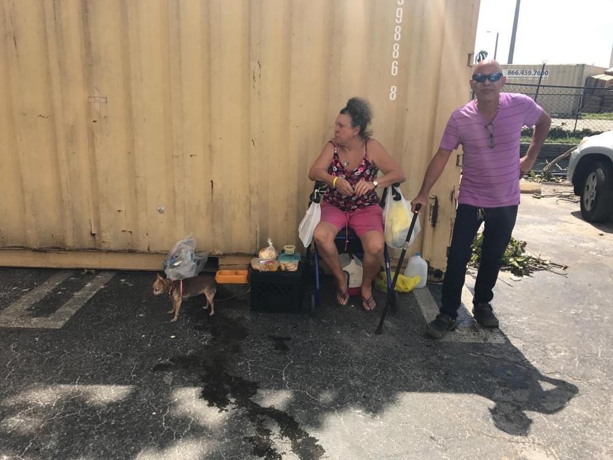 Maria Rojas and Fernando Delgado wait for more information on the status of their building at Civic Towers in Allapattah on Tuesday, Sept. 12. Rojas racked up her credit card to stay in a hotel for five nights during Hurricane Irma. She said she could never stay in a shelter after two bad experiences years ago. Delgado was able to stay with his daughter to ride out the storm, but was unable to return to his apartment on Tuesday.
