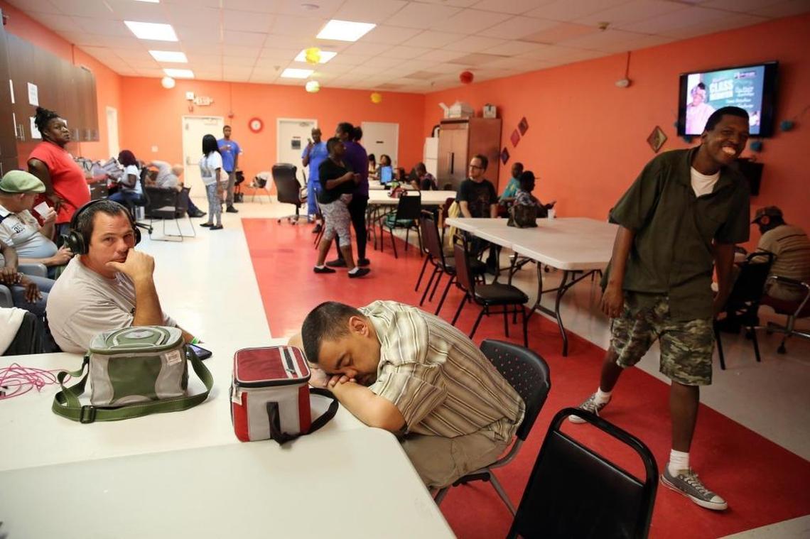 Mac Town (the Miami Achievement Center for the Developmentally Disabled) has opened its doors to some of their other facilities that needed to be evacuated due to Irma. Mario Delahiguera, of the Gator group home, takes a nap with his head on the table, after a tiring day of moving from his group home to Mac Town on Friday afternoon, Sept. 8, 2017.