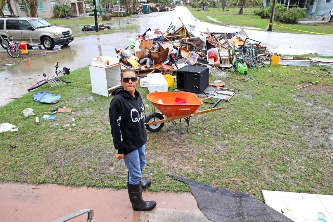 Candy Daniels stands outside the Chokoloskee house her grandmother built after Hurricane Donna, where her father now lives. Irma flooded the house with about two feet of water.
