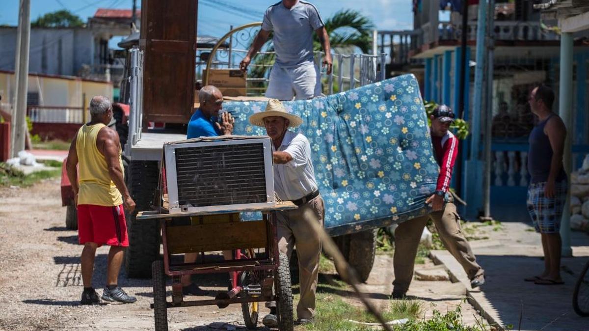 People secure their belongings ahead of Hurricane Irma in Caibarien, Cuba. Cubans are bracing for the arrival of Hurricane Irma after it cut a path of devastation across the northern Caribbean, leaving thousands homeless after destroying buildings and uprooting trees.