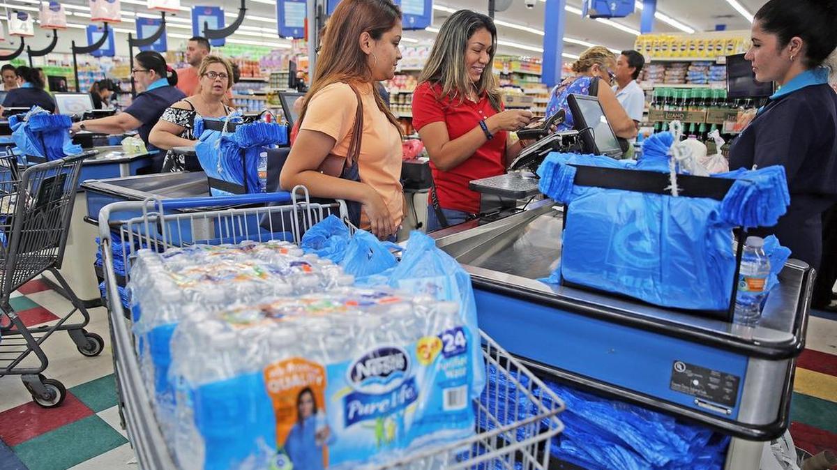 Ana de la Rosa, right , along with her daughter Katherine de la Rosa-22, stocks up on water at Presidente Supermarket on Calle Ocho in Little Havana, as she prepares for the possibility of Hurricane Irma reaching South Florida shores by the end of the week on Monday, September 4, 2017.