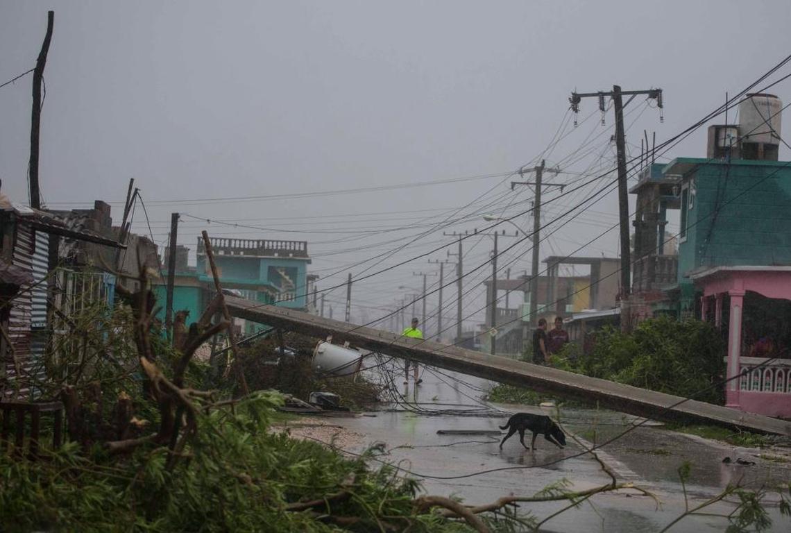 Residents ventured out to find downed power lines and trees uprooted by Hurricane Irma, in Caibarien, Cuba, on Sept. 9.