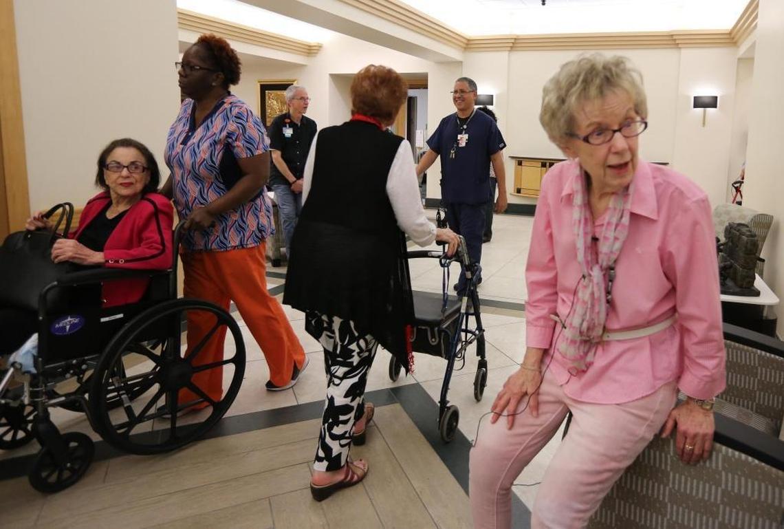 The elderly and those with special needs are some of the most vulnerable in the community. At Miami Jewish Health Systems at 5200 NE 2nd Ave, Miami, instead of evacuating the elderly for Hurricane Irma, they are taking in even more. Residents and visiting guests of the facility pass in the hallway headed to their rooms while resident, Marion Ulloa sits in the hallway on a chair on Friday afternoon, Sept. 8, 2017.