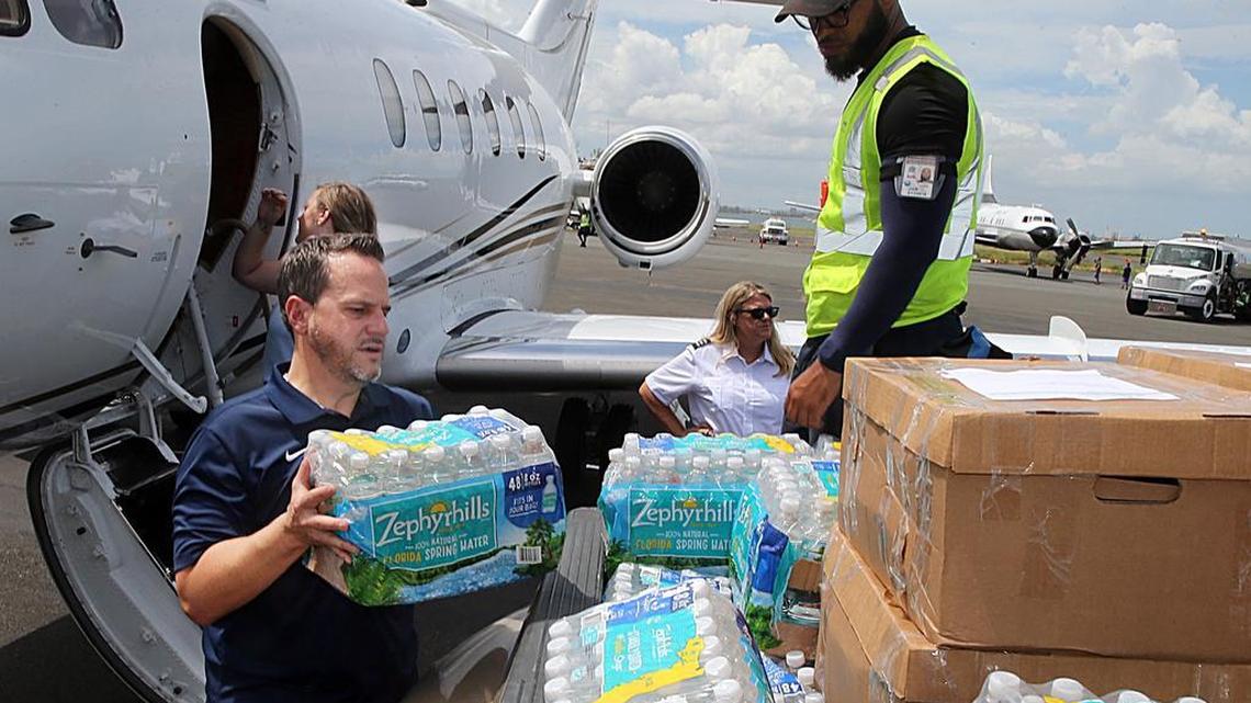 Alex MacNamara, executive director, facilities at Nova Southeastern University, helps to unload about 2,000 pounds of supplies at Signature airport brought on a flight from Fort Lauderdale to be deliver to Nova’s San Juan campus in the aftermath of Hurricane Maria.