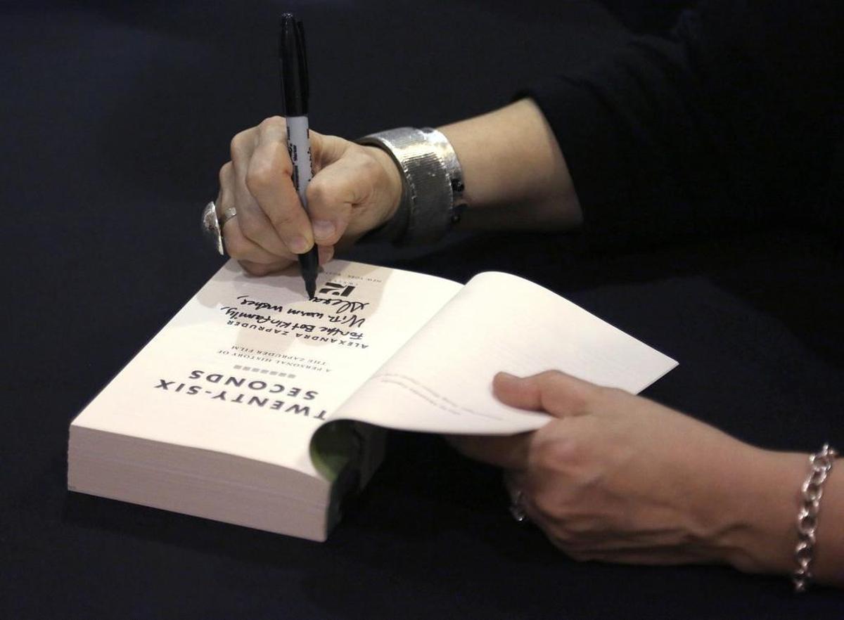 Alexandra Zapruder, granddaughter of Abraham Zapruder, who filmed the JFK assassination, signs copies of her book.