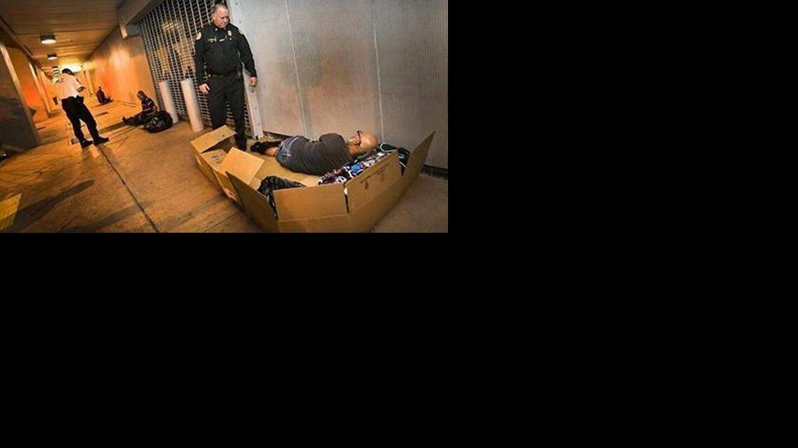 
ON THE STREET: Miami police officer enforcing city ordinances being broken by the homeless. 
