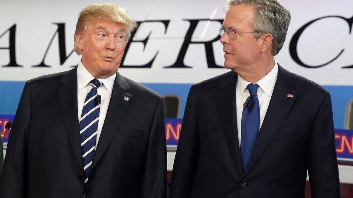 
Donald Trump and Jeb Bush talk before debate. 
