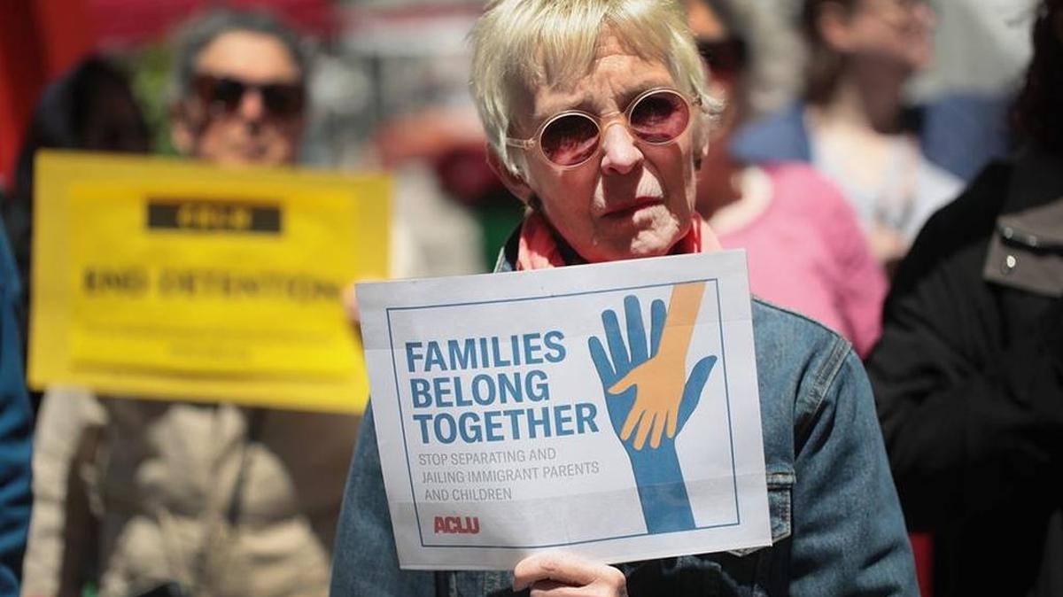 Woman protests the policy that allows federal agents to separate undocumented migrant parents and their children at the border.