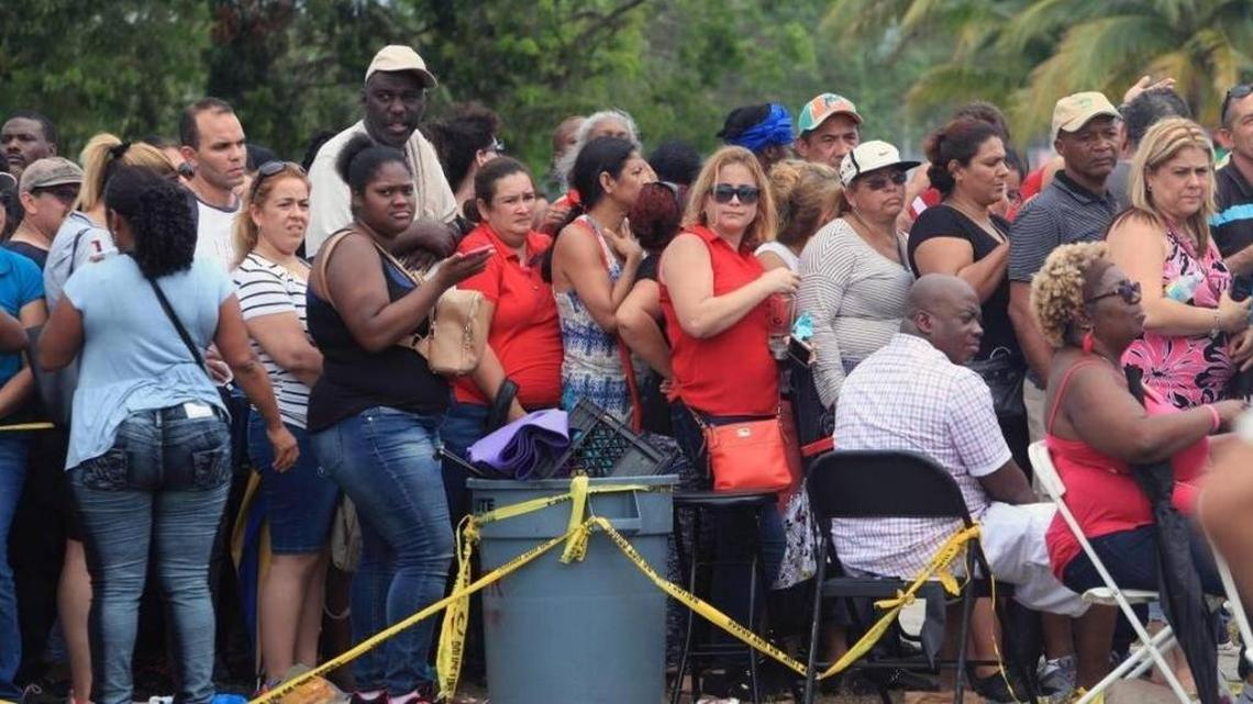 People waiting in line at the food-stamp assistance center at Amelia Earhart Park in Hialeah on Saturday. Similar centers in Miami-Dade and Broward closed after overwhelming response.