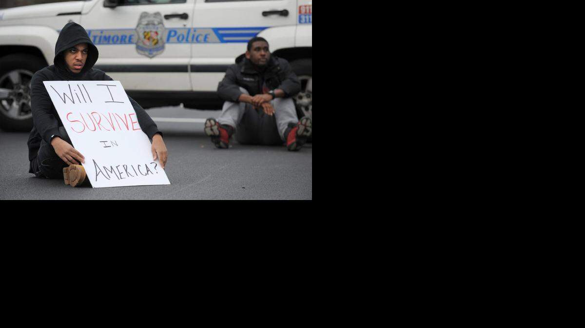 
WAITING FOR ANSWER: Jimmy Sellers, a Morgan State University senior, during a rally in Baltimore in the wake of the grand jury decision not to indict officer Darren Wilson in the shooting death of Michael Brown
