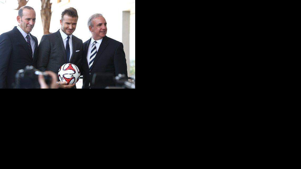 
David Beckham, with MLS Commissioner Don Garber and Miami-Dade Mayor Carlos Gimenez, right.
