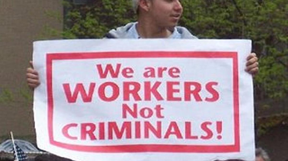 
MAKING A STATEMENT: A young immigrant makes clear why he is in the United States.
