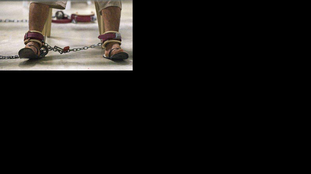 
SHACKLED: Guantánamo detainee in restraints. The Obama administration has restricted media coverage of the detention center.
