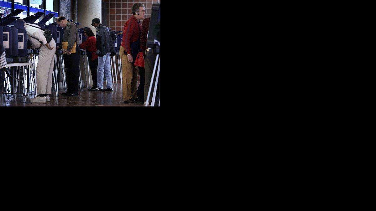 
CASTING A BALLOT: Residents use touch-screen machines during the first day of early voting in the 2008 presidential primary at the Stephen P. Clark in Miami.
