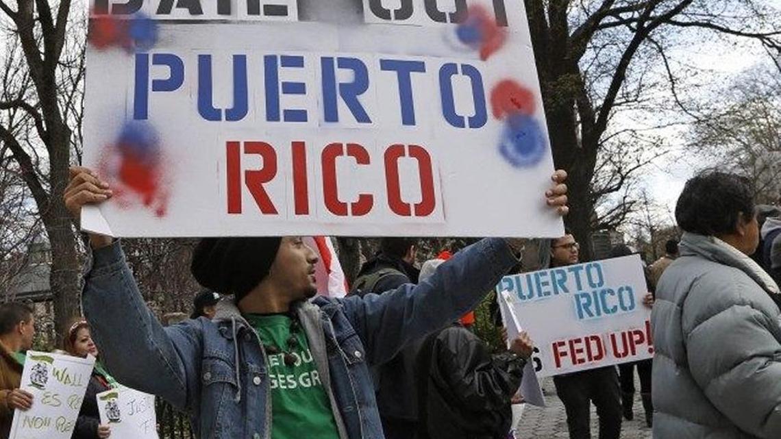 Supporters of a Puerto Rico bailout demonstrate outside Congress.