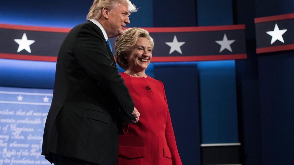 Democrat Hillary Clinton stands with Republican presidential nominee Donald Trump at the start of Monday’s debate.
