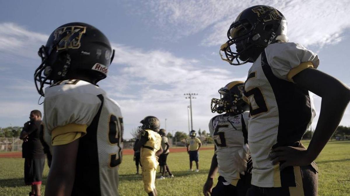 Young boys on the Liberty City Warriors football team, co-founded by Luther Campbell.