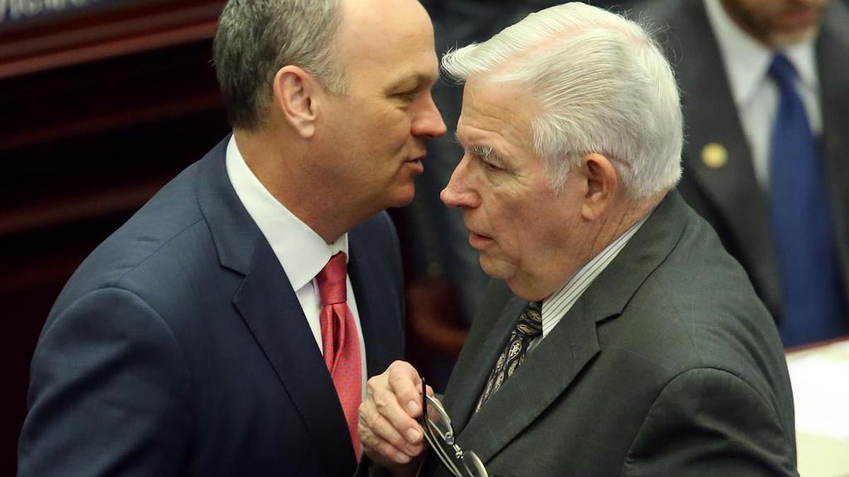 State Rep. Rep. Charles Van Zant, right, who has filed an anti-abortion bill, confers with fellow Rep. Richard Corcoran.