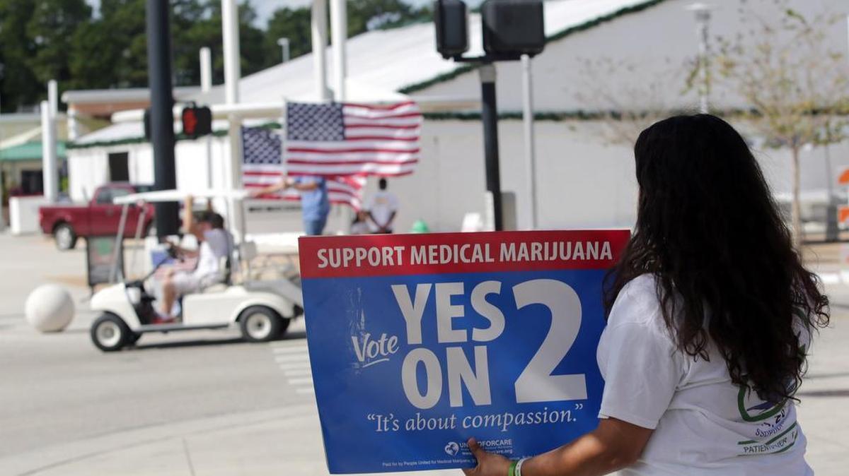 In 2014, University of Central Florida student Denisse Delmonte held a sign in favor of the medical-marijuana initiative, which Floridians rejected by a slim margin.