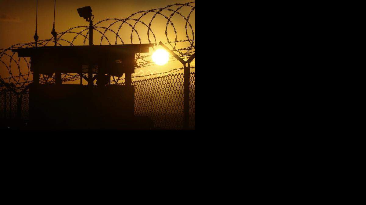 
A detainee at Guantánamo, pictured at sunrise, is suing to have forced-feeding declared torture.
