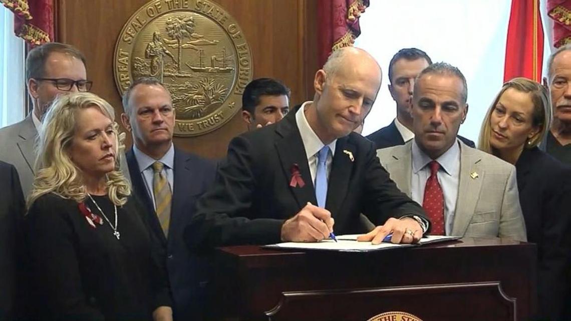 Gov. Rick Scott signs into law Florida’s first gun-control measures in three decades.