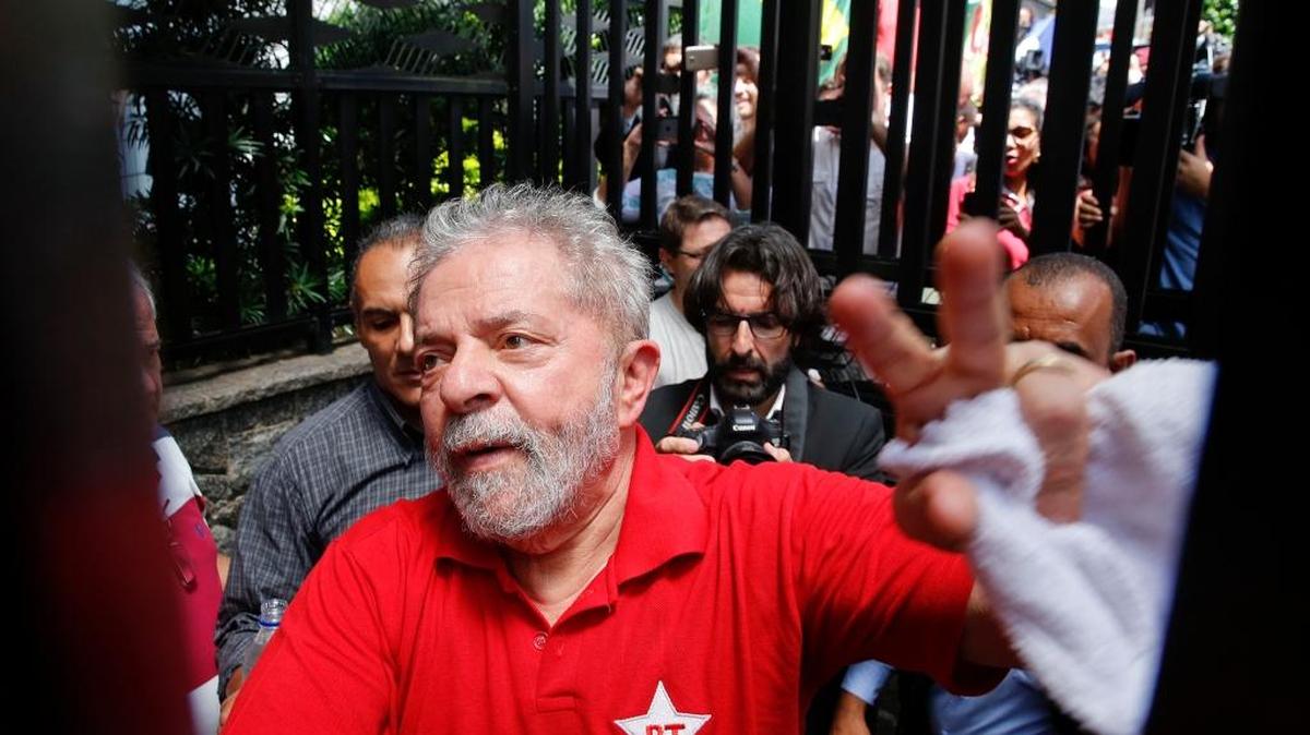 Former Brazilian President Luiz Inacio Lula da Silva greeted supporters after he was held for questioning by police.
