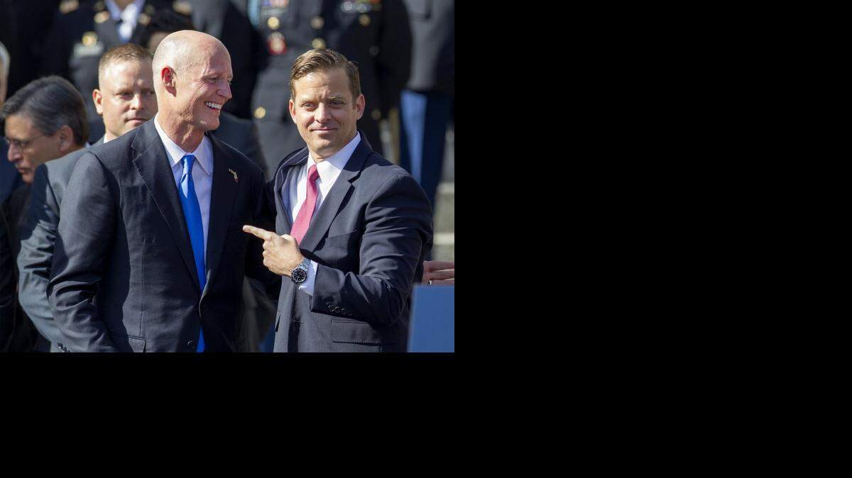 
Gov. Rick Scott and Lt. Gov. Carlos Lopez-Cantera share a laugh at the Tallahassee inauguration ceremony. 

