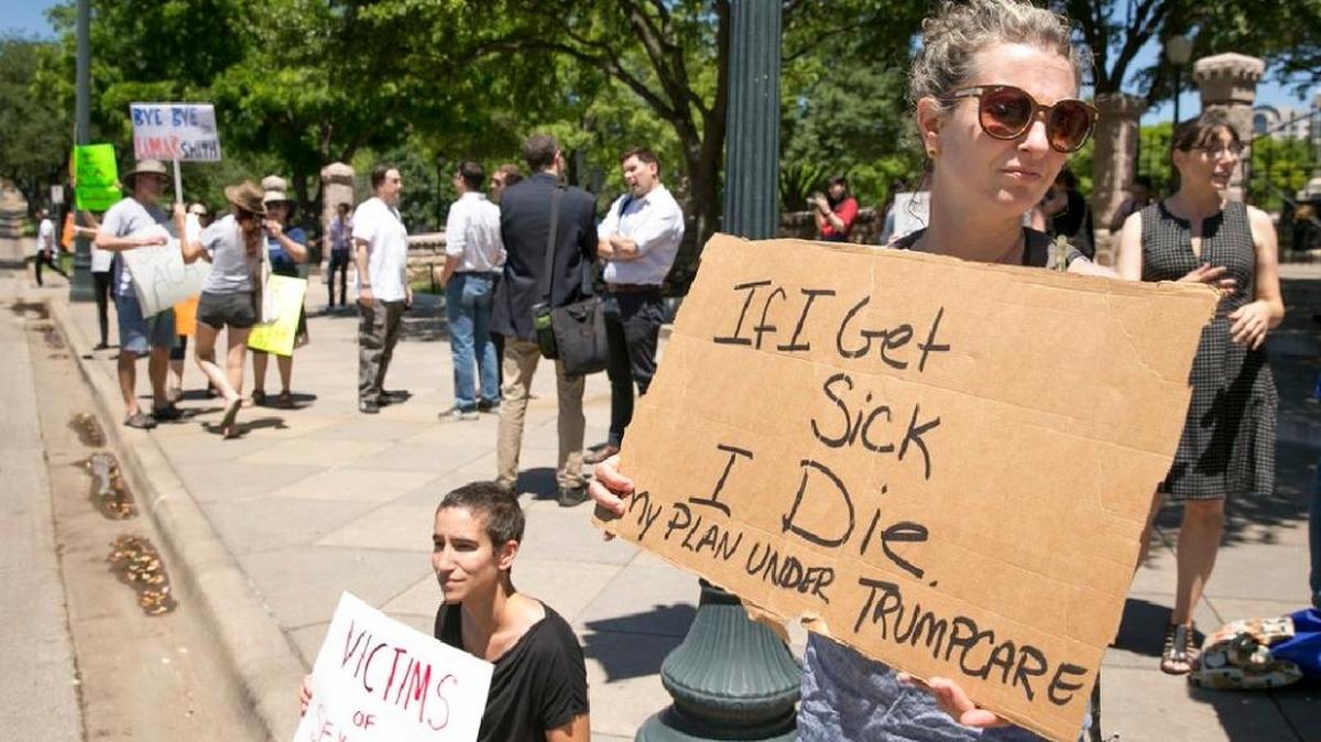 Protesters make clear that they don’t want the Afforfable Care Act repealed.