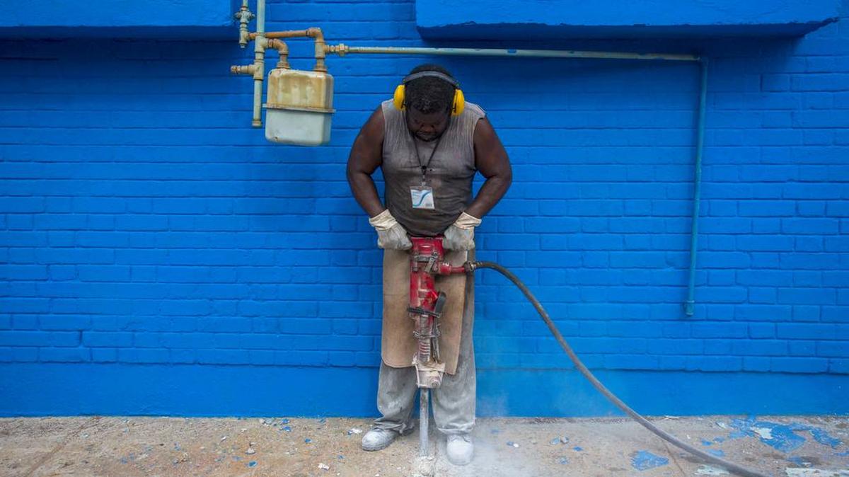 A worker uses a jackhammer outside the Havana baseball stadium where President Obama will attend an exhibition game.