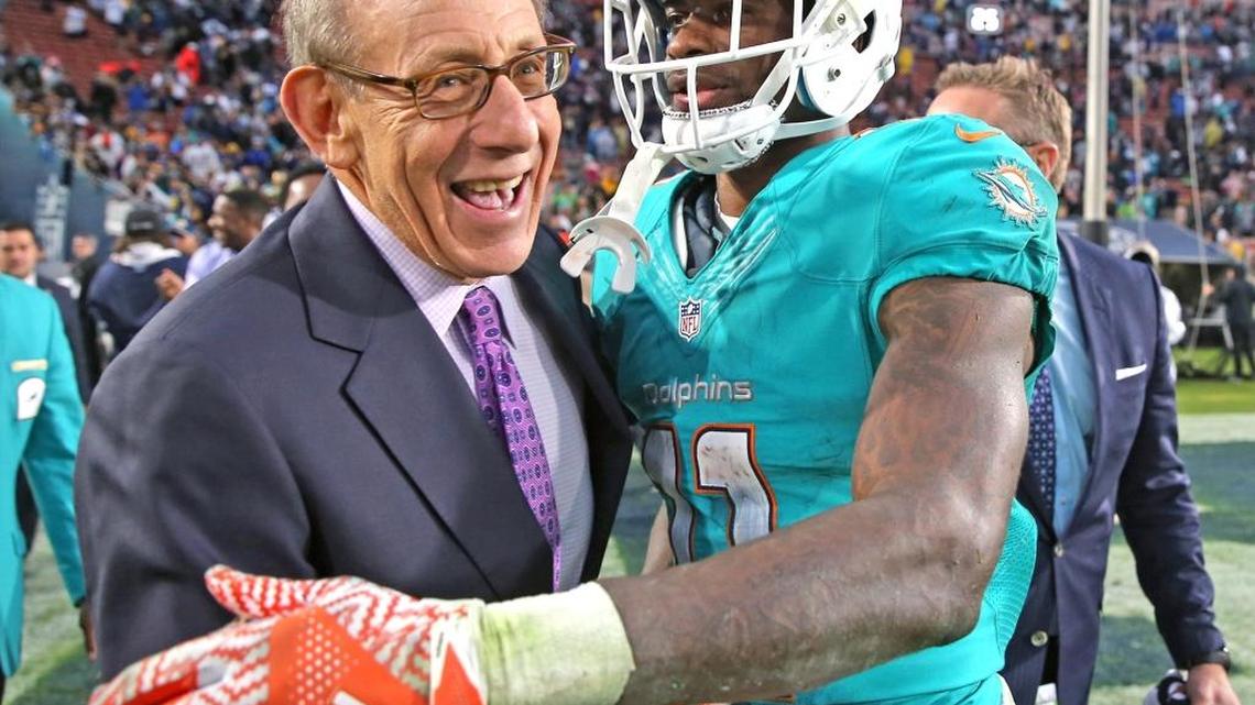 A joyful Ross celebrates with DeVante Parker after Parker caught the winning touchdown against the L.A. Rams last year.