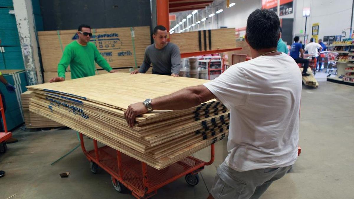 Residents stock up on plywood in advance of Hurricane Matthew in Home Depot at the Mall of the Americas.