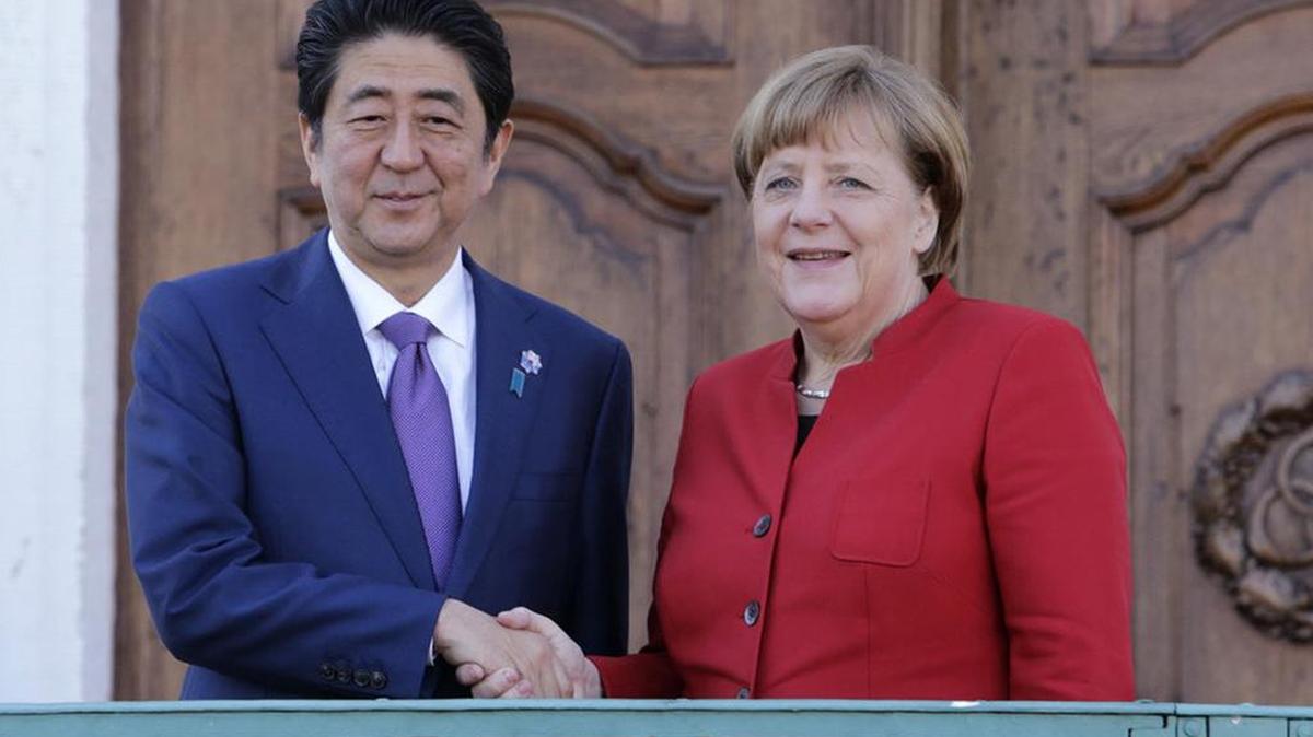 German Chancellor Angela Merkel, right, and Japanese Prime Minister Shinzo Abe pose during a meeting earlier this year.