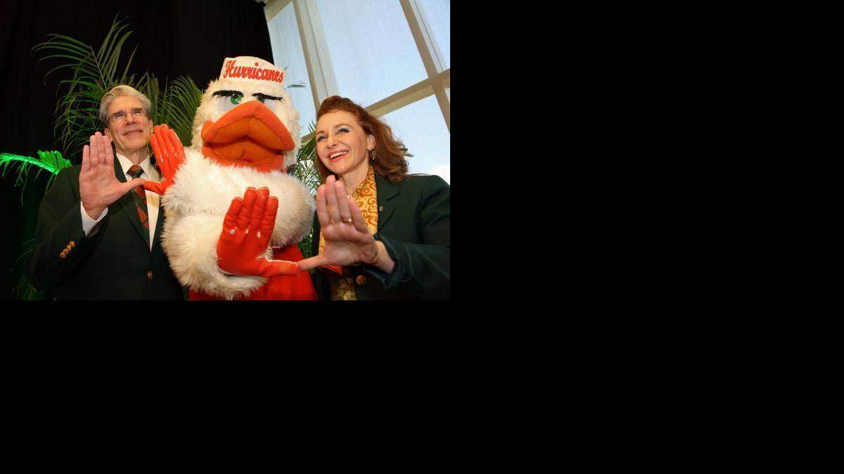 
University of Miami’s new president-elect Julio Frenk, with mascot Sebastian and his wife, Felicia Knaul, throwing up the “U” Monday after winning the top post at the university. 
