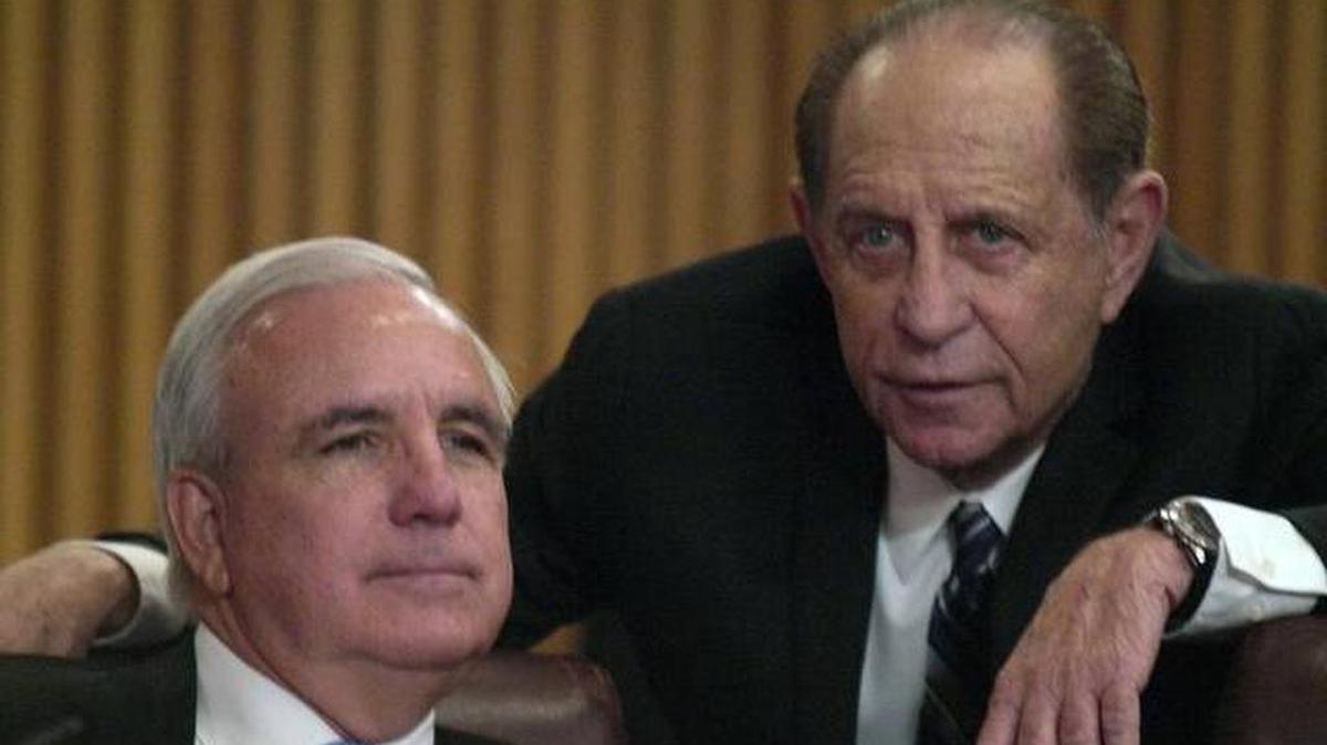 Miami-Dade Mayor Carlos Gimenez, left, and Harvey Ruvin, clerk of the courts, have a conversation during a 2018 meeting in the County Commission chambers. In 2018, Miami-Dade voters approved making the clerk a nonpartisan post, like the office of county mayor, but a recent Florida Supreme Court ruling invalidates that change.