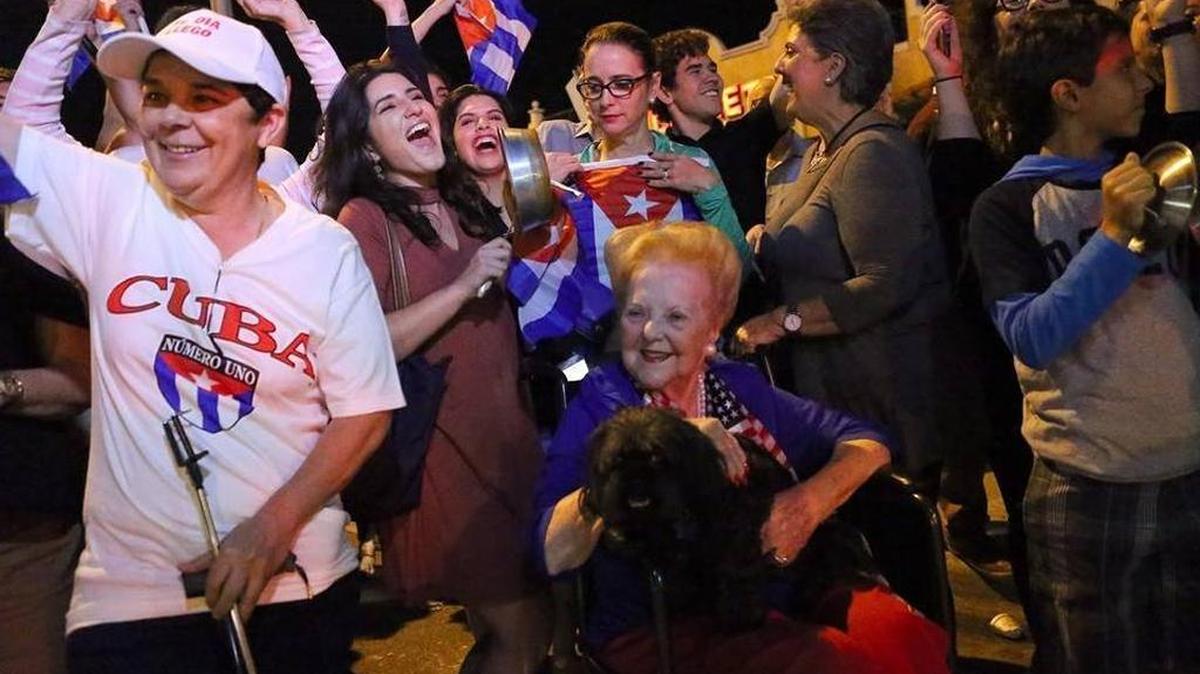 Cuban exiles of all ages celebrate outside La Carreta Restaurant on Southwest 87th Avenue.