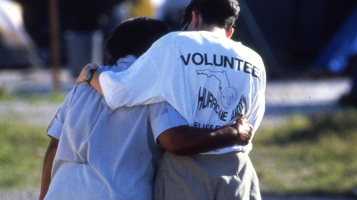 A volunteer offers solace to a resident after Hurricane Andrew in 1992.