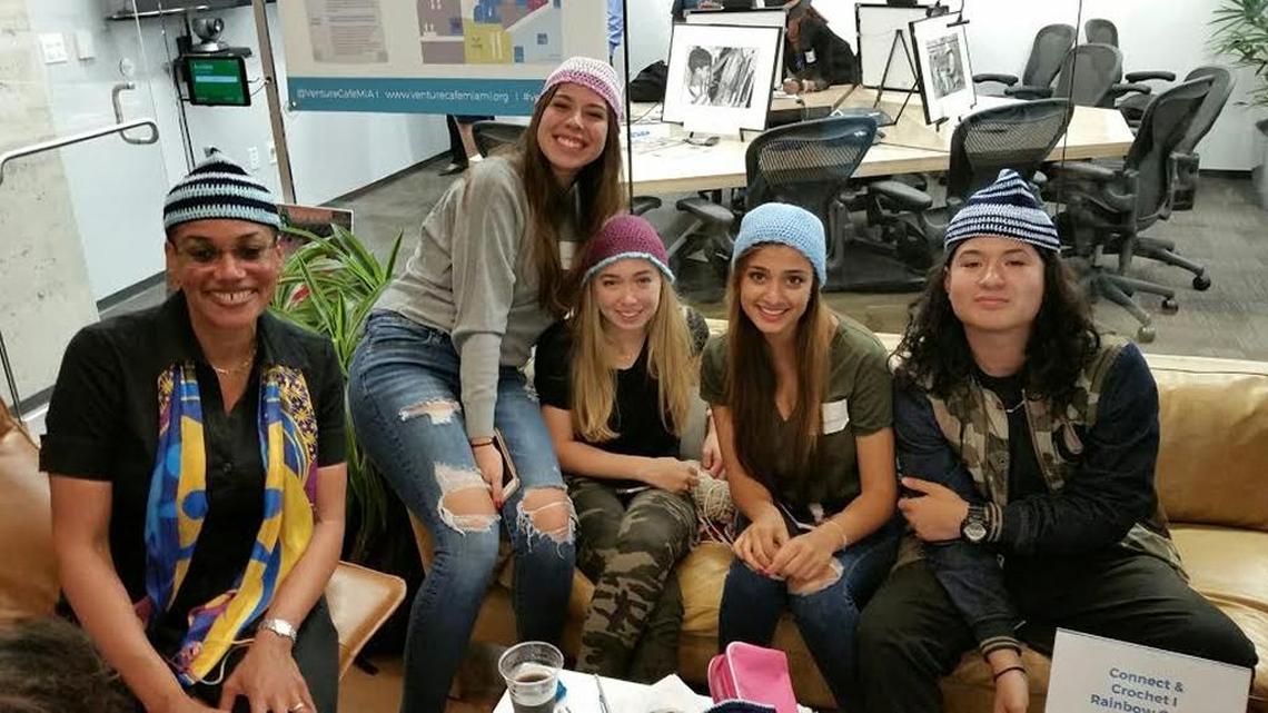 Stephanie Sylvestre, of The Children’s Trust, connected with students learning to crochet.