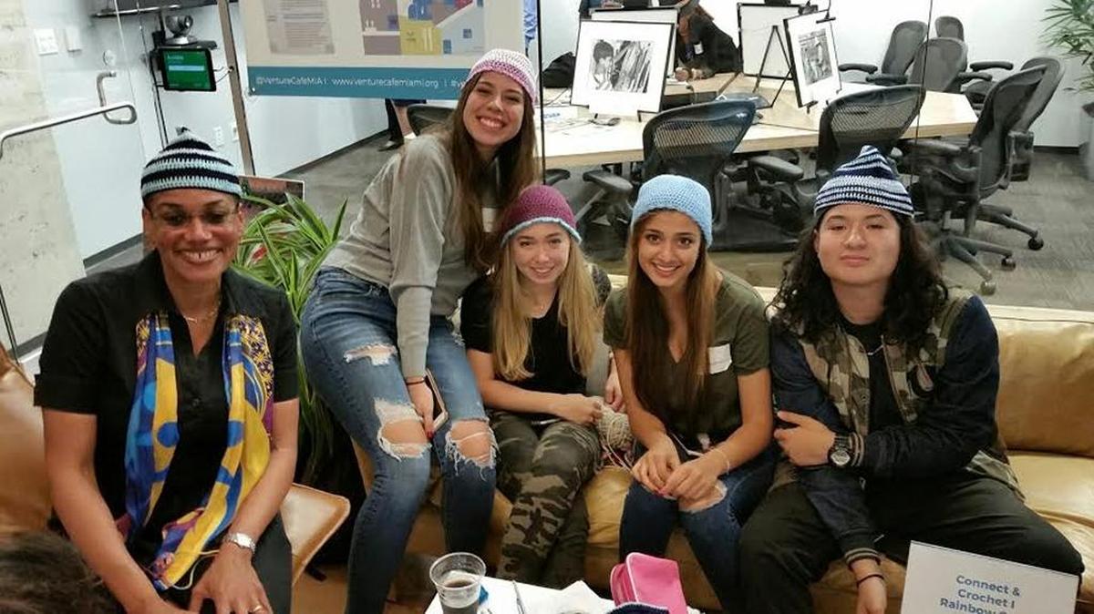 Stephanie Sylvestre, of The Children’s Trust, connected with students learning to crochet.