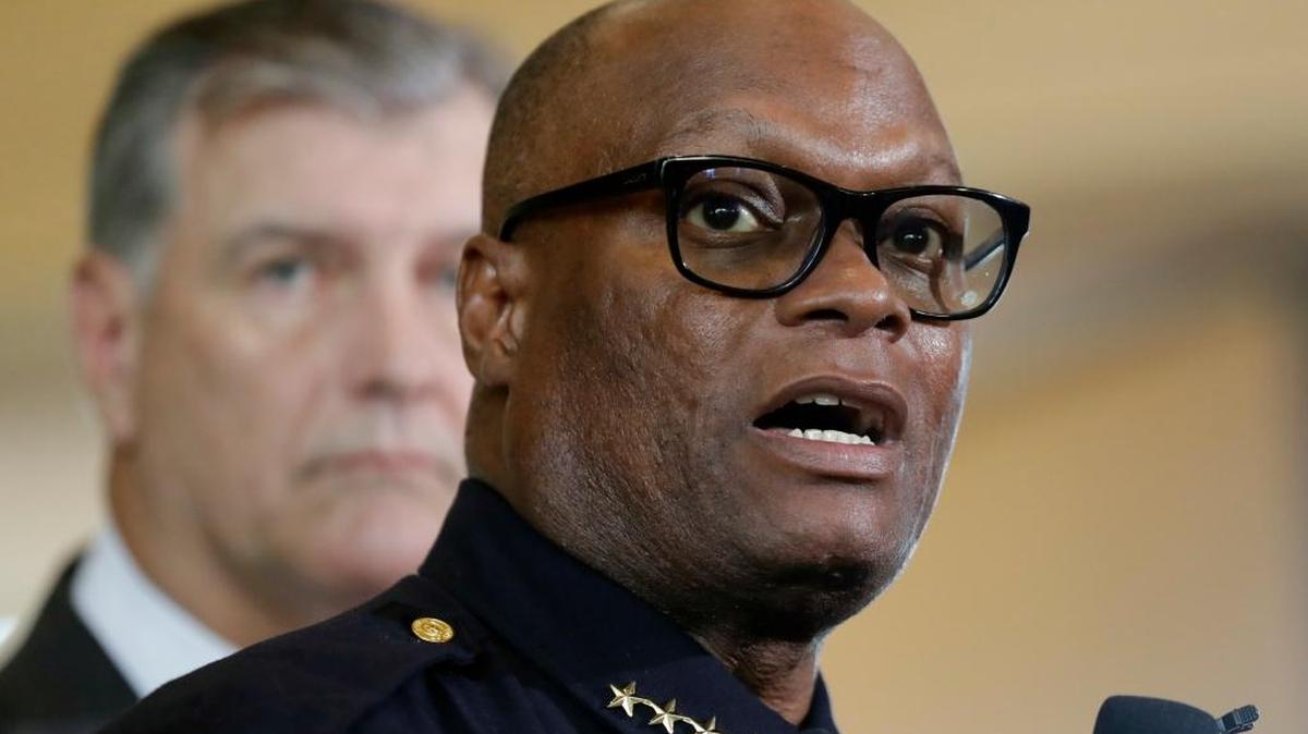Dallas Chief David Brown talks to the news media on Friday after the sniper killings. Dallas mayor Mike Rawlings is behind him.