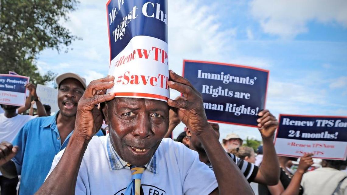 Jean Claude Akkawy Damus joins Haitian and immigration advocates hold a rally Saturday demanding the Trump administration extend Temporary Protected Status for Haitians as they march at U.S. Citizenship and Immigration Services office on Saturday, May 13, 2017.