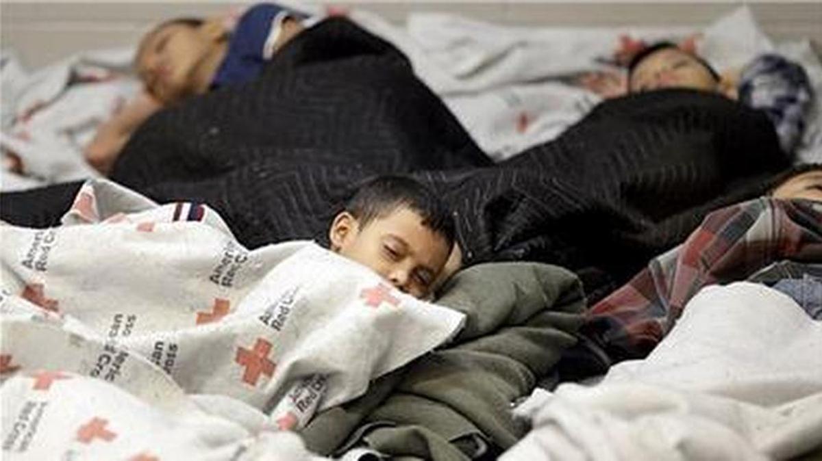 
BEING HELD:  A Central American child sleeps with his family at a U.S. detention center.

