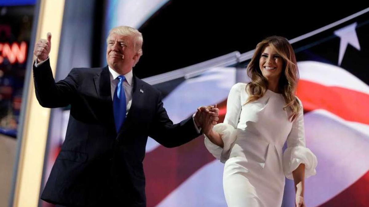 Donald Trump escorts his wife, Melania, from the convention stage after her speech Monday night. Parts of her remarks matched almost word for word first lady Michelle Obama’s speech at the 2008 Democratic National Convention.