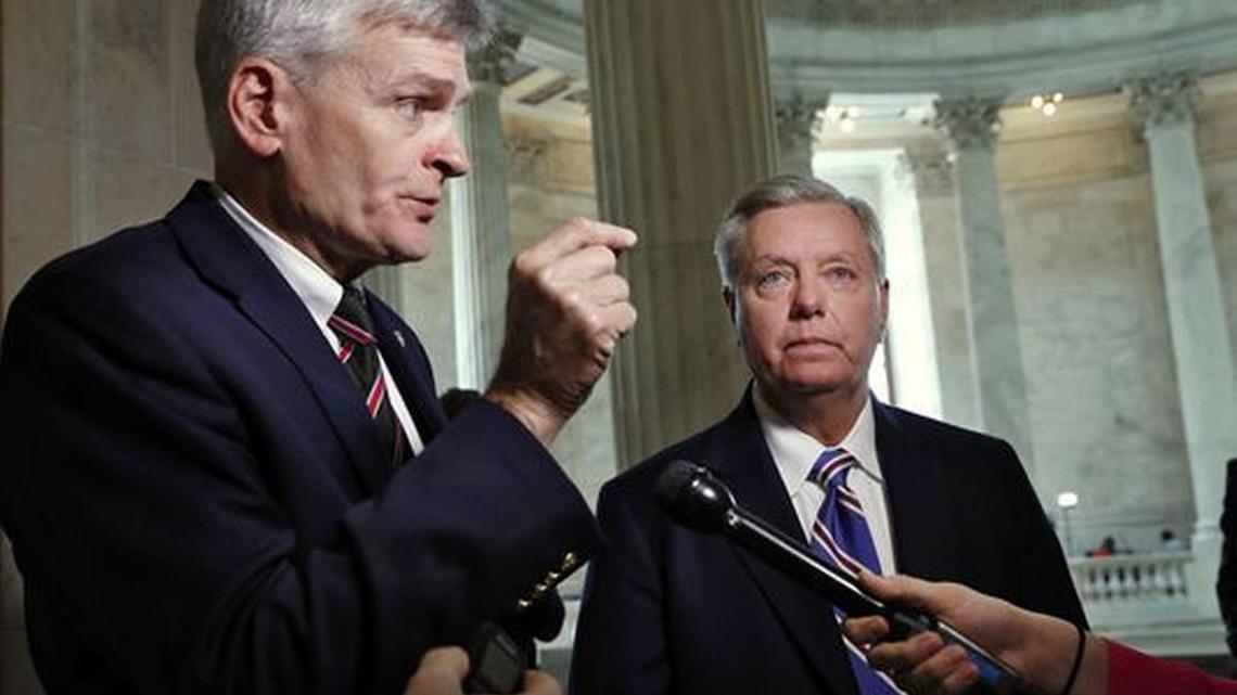 Republican Sens. Bill Cassidy, left, and Lindsey Graham propose to let states handle their healthcare systems.
