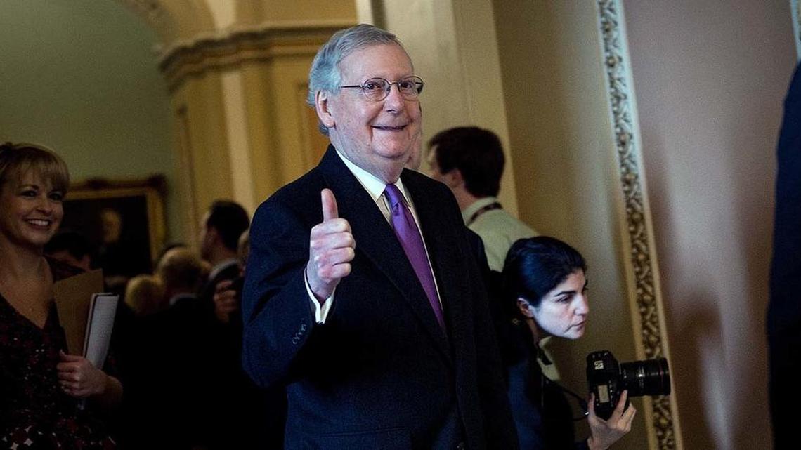Senate Majority Leader Mitch McConnell gives the thumbs-up Monday after the Senate voted to end the shutdown.