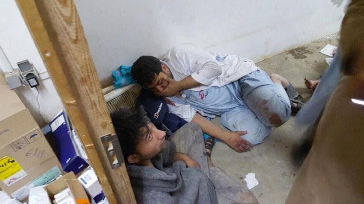
Injured Doctors Without Borders staff huddle after an explosion near their hospital in Kunduz, in northern Afghanistan. 
