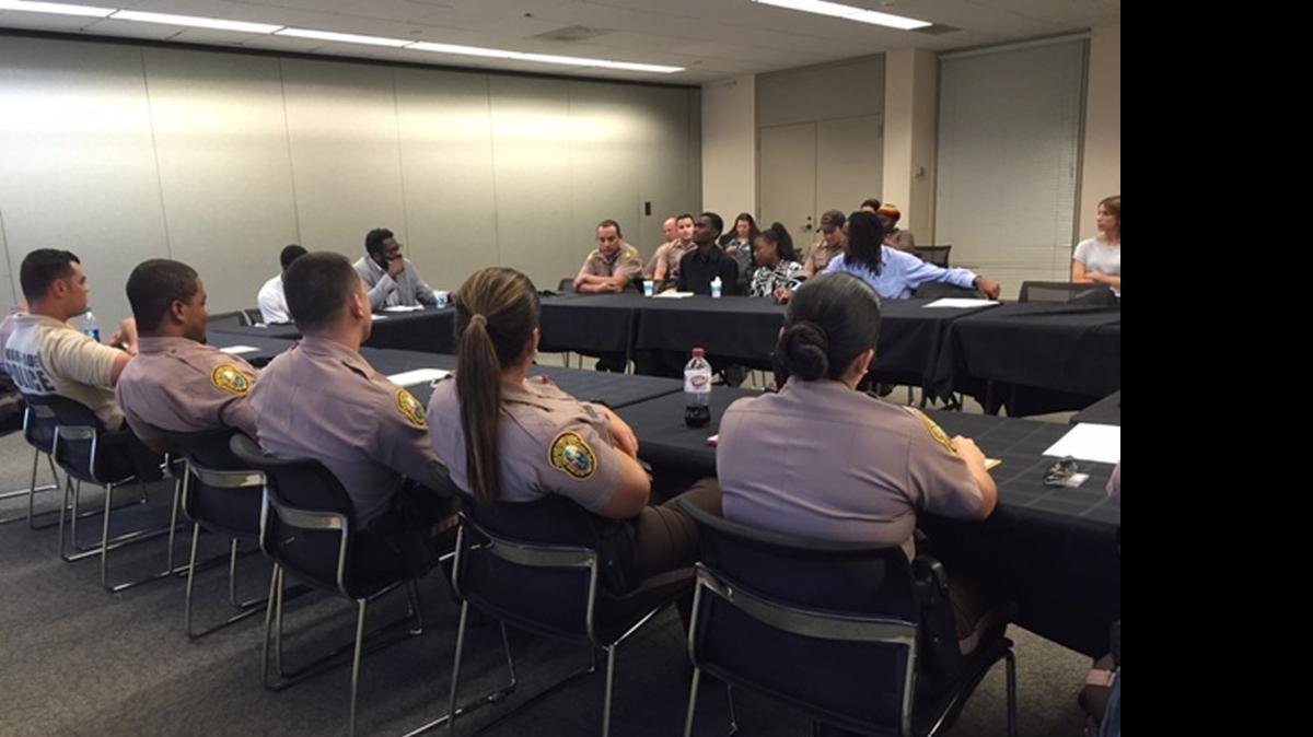 
OPENING CHANNELS: Group of Miami-Dade officers and local teens discuss how they interact.

